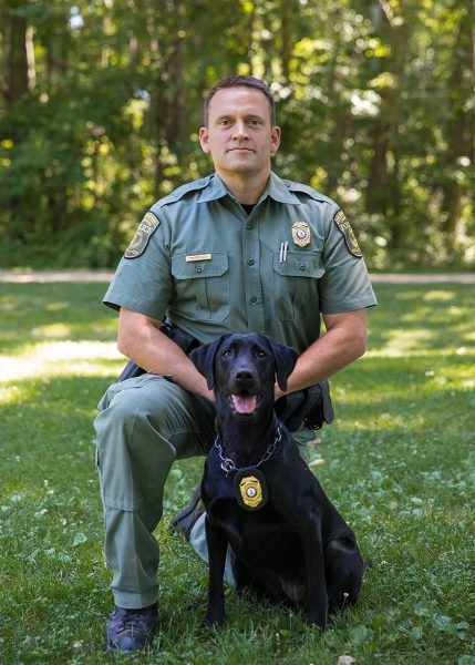CPO Jim Patrillo at K9 black lab Bailey